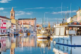 Photo of Cervia's canal, where the Salt Museum is located, with reflections on the water ,Italy.