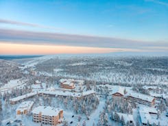 photo of beautiful view of Finnish landscape with trees in snow, ruka, karelia, lapland, hilly winter landscapes in famous winter sports area called Ruka.