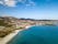 Photo of aerial view of Pittulongu, White Beach in Olbia, blue water, amazing Vegetation and sandy beaches with Tavolara island view, Italy.