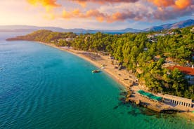 Photo of panoramic aerial view of the popular Platis Gialos beach on the Greek island of Mykonos with turquoise sea, Greece.