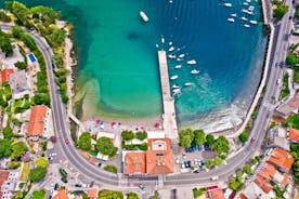 photo of aerial panoramic view of beautiful town of Lovran and sea walkway in Croatia.