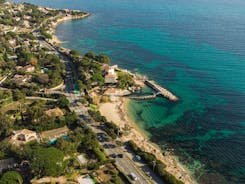 Photo of beautiful aerial view of Saint-Tropez, France with seascape and blue sky.