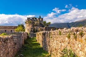 Photo of temple of Apollo with Acrocorinth in the background. Ancient Corinth, Greece.