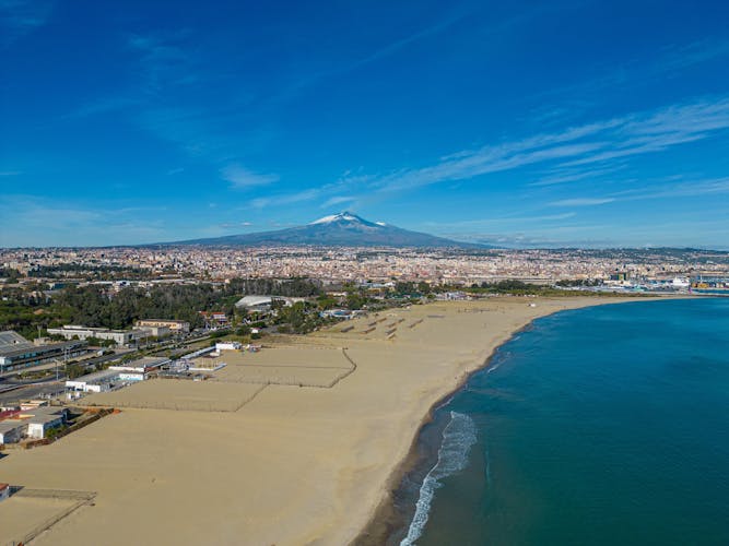 Photo of aerial view of beautiful beach and Etna volcano in Catania ,Sicily ,Italy.