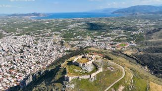 Photo of a small island with a fortress at the coast of Nafplio ,Greece.