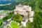 Hohenwerfen Castle or Festung Hohenwerfen aerial panoramic view. Hohenwerfen is a medieval rock castle overlooking the Austrian Werfen town in Salzach valley, Austria