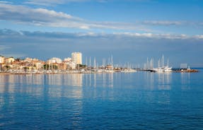 Photo of beautiful aerial view of Saint-Tropez, France with seascape and blue sky.