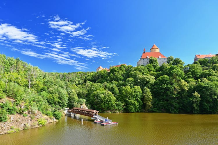 Photo of beautiful old castle Veveri. Landscape with water on the Brno dam during summer holidays.