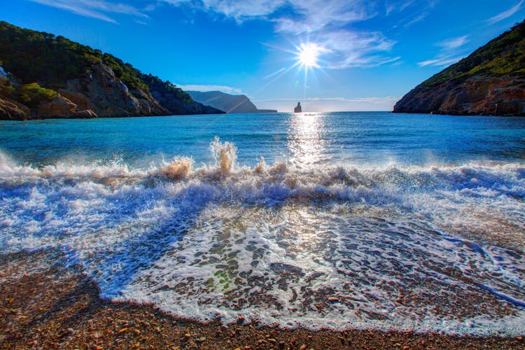 Photo of Ibiza Cala Benirras beautiful beach at sunset in san Juan at Balearic Islands ,Spain.