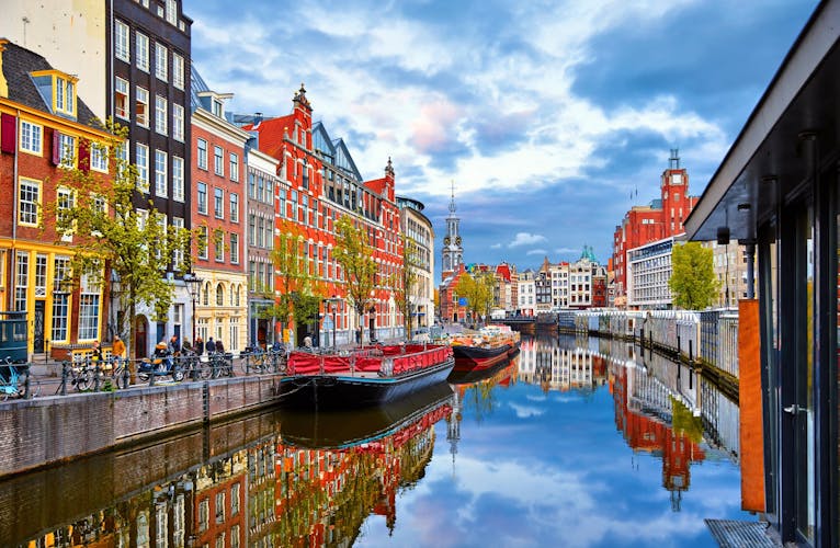 Channel in Amsterdam Netherlands houses river Amstel landmark old european city spring landscape.