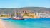 photo of panoramic view of Saint Peter Castle (Bodrum castle) and marina view of Bodrum beach in the foreground in Bodrum, Turkey.