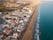Photo of aerial view of coast at Calafell cityscape with modern apartment buildings, Spain.
