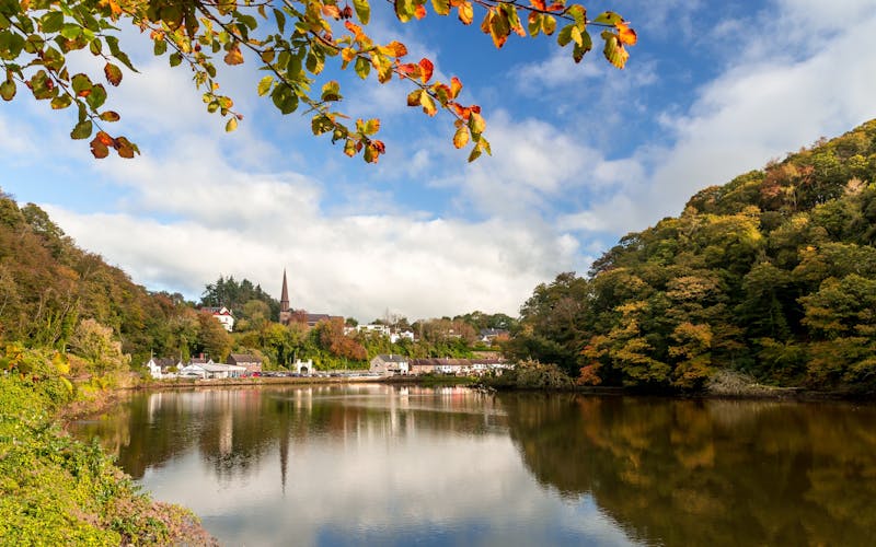 photo of view of Glanmire Village Cork Ireland beautiful view autumn orange leaves river reflection