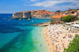 Photo of panorama and landscape of Makarska resort and its harbour with boats and blue sea water, Croatia.