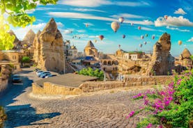 Hot air balloons flying over Uchisar Castle. Cappadocia. Nevsehir Province. Turkey.