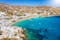 Photo of panoramic aerial view of the popular Platis Gialos beach on the Greek island of Mykonos with turquoise sea, Greece.