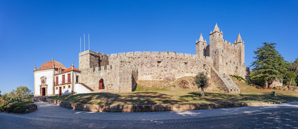 Photo of Castelo da Feira Castle with Nossa Senhora da Esperanca Chapel on the left. Santa Maria da Feira, Portugal.