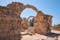 Photo of the arches of Saranta Kolones castle the medieval fortress built on the site of an earlier Byzantine fort. Paphos Archaeological Park, Cyprus.