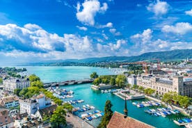 Panoramic view of historic Zurich city center with famous Fraumunster, Grossmunster and St. Peter and river Limmat at Lake Zurich on a sunny day with clouds in summer, Canton of Zurich, Switzerland