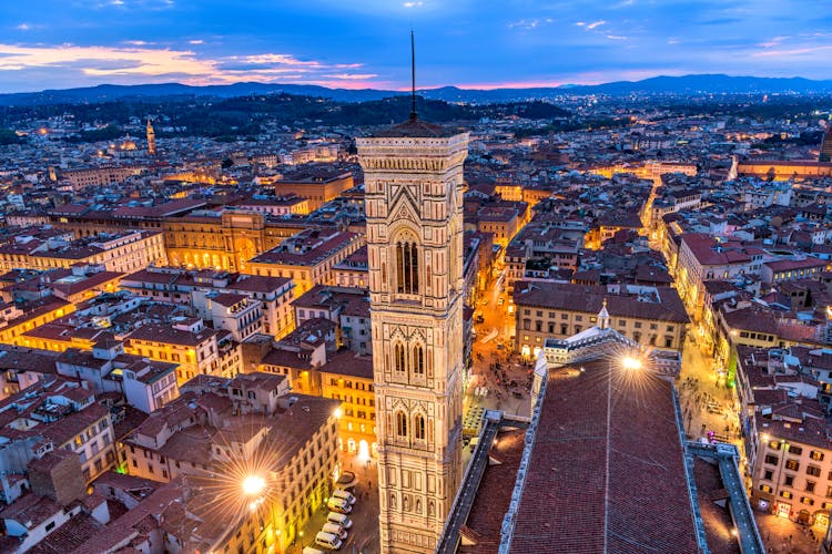 Photo of Giotto's Campanile - An aerial dusk view of Giotto's Campanile and the historical Old Town of Florence, as seen from the top of Brunelleschi's Dome of the Florence Cathedral. Florence, Tuscany, Italy.