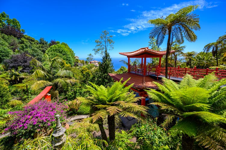 Photo of Monte Palace Tropical Garden with Waterfalls, Lakes and traditional buildings above the city of Funchal.
