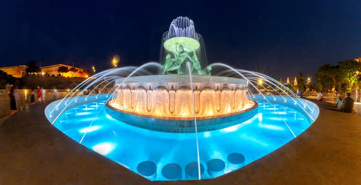 Photo of the famous Triton Fountain at night in the historical part of the old city, Valletta, Malta.