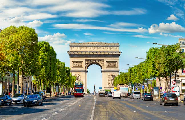 Photo of road of Champs Elysee leading to Arc de Triomphe in Paris, France.