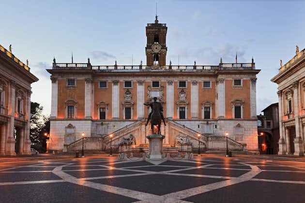photo of Italy rome capital city capitoline hill landmark square surrounded by neo classic museums buildings with clock tower and bronze statue of Mark Aurelius at sunrise.