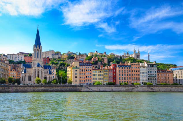 Photo of Lyon cityscape from Saone river with colorful houses and river.