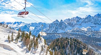 photo of the romantic, Snow covered Skiing Resort of Cortina d Ampezzo in the Italian Dolomites seen from Tofana with Col Druscie in the foreground.
