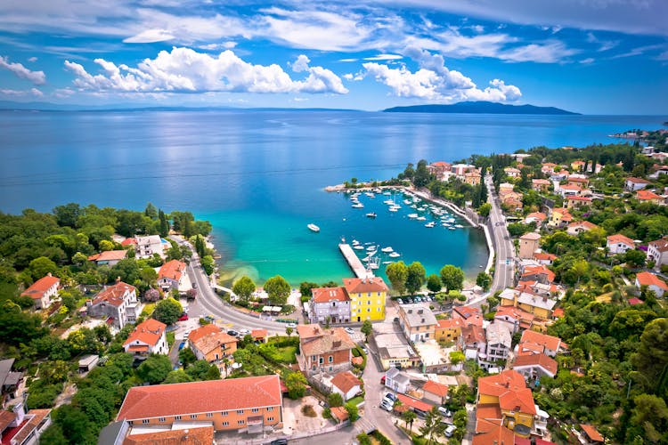 Photo of Icici village beach and waterfront in Opatija riviera aerial view, turquoise sea and blue sky, Kvarner, Croatia.