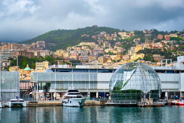 PHOTO OF Old Port Porto Antico of Genoa (Genova) with yachts and boats with aquarium biosphere building under stormy sky. Genoa, Italy .