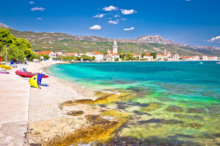 Photo of Kastel Stafilic landmarks and turquoise beach view, Split region of Dalmatia, Croatia.