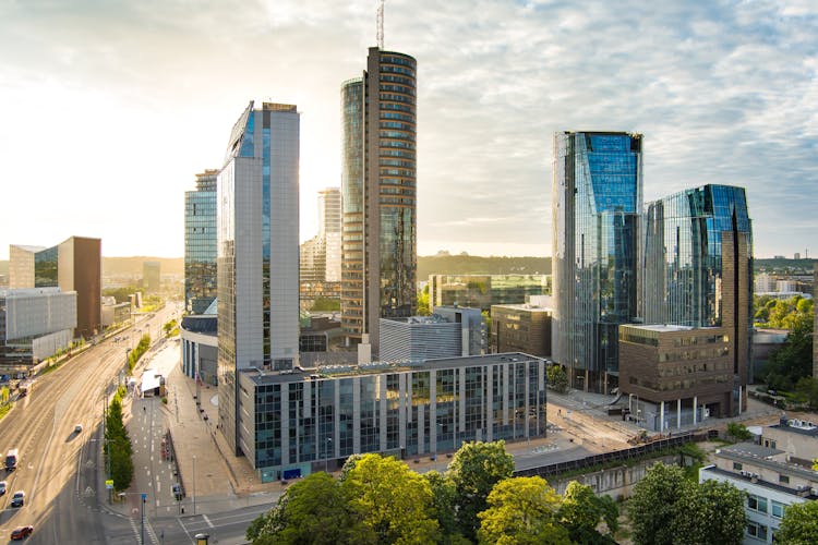 Photo of beautiful aerial evening view of Vilnius business district with scenic sunset illumination.
