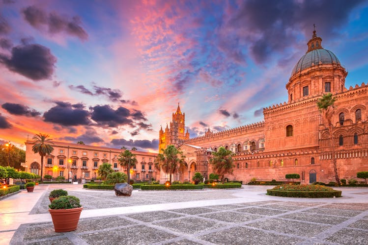 Photo of Palermo Norman cathedral, a UNESCO world heritage site in Italy, colored sunset sky.