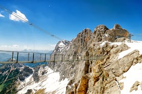 Photo of Suspension Bridge of Dachstein Skywalk viewpoint in Austria, with people, in Ramsau am Dachstein.