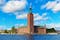 photo of scenic summer view of the Stockholm City Hall in the Old Town (Gamla Stan) in Stockholm, Sweden.