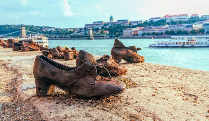 Photo of old metal rusty shoes on the parapet of the Danube river embankment in Budapest, Hungary. 