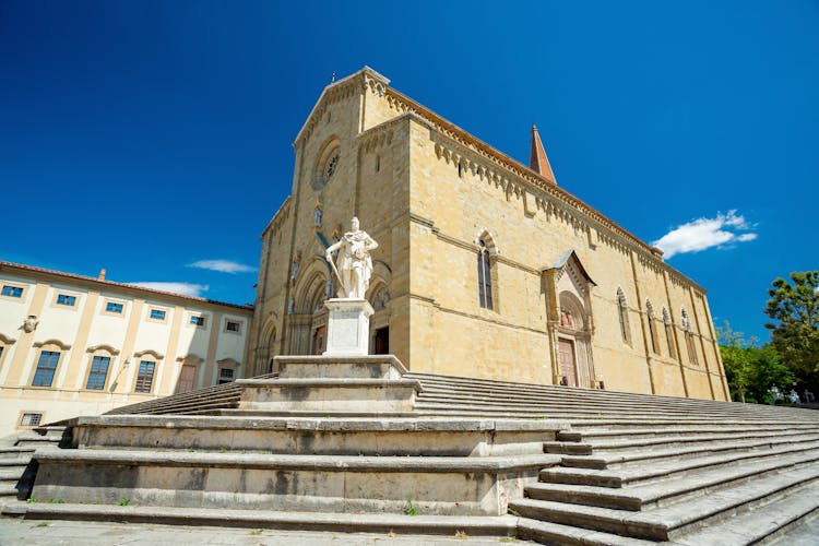 photo of view of Arezzo cathedral and Medici monument, Italy.