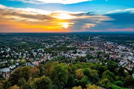Photo of aerial view of the historic city center of Freiburg im Breisgau from famous old Freiburger Minster in beautiful evening light at sunset, Germany.