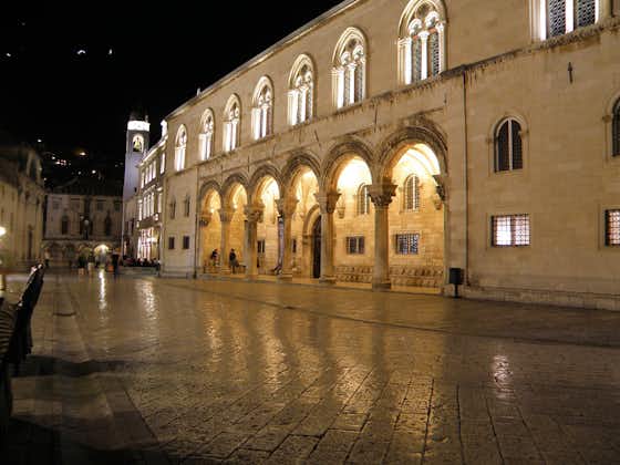 Photo of the architecture of the Rector's Palace at night that is a mix of late Gothic and early Renaissance styles and due to an unfortunate series of events.The Palace was built in the 15th Century in Dubrovnik, Croatia.