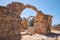 Photo of the arches of Saranta Kolones castle the medieval fortress built on the site of an earlier Byzantine fort. Paphos Archaeological Park, Cyprus.