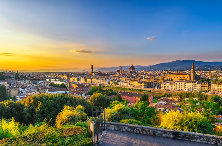 Photo of Sunset view of Florence, Ponte Vecchio, Palazzo Vecchio and Florence Duomo, Italy. Architecture and landmark of Florence. Cityscape of Florence.